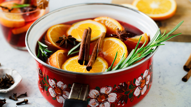 Vintage red, floral-patterned pot full of mulled wine