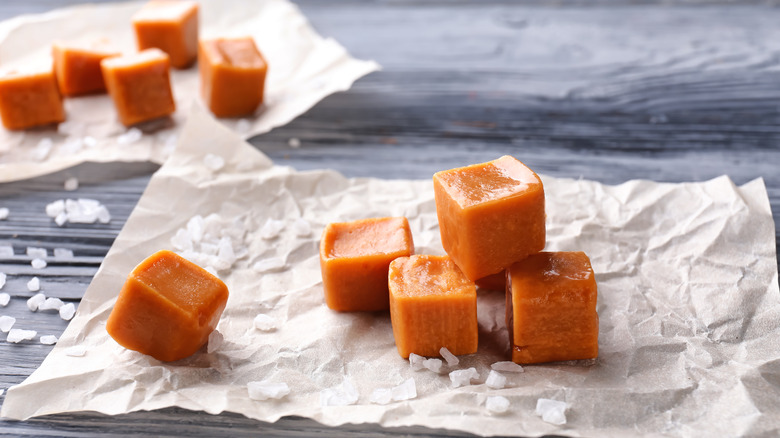 Homemade caramel candies on parchment paper