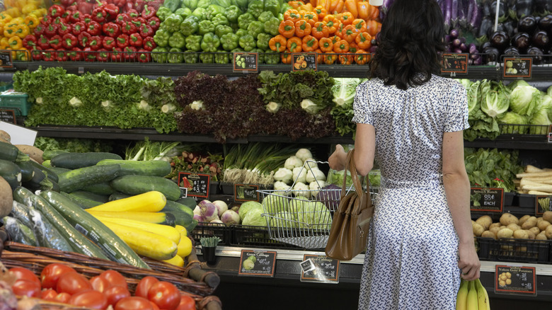 Woman shopping in produce aisle