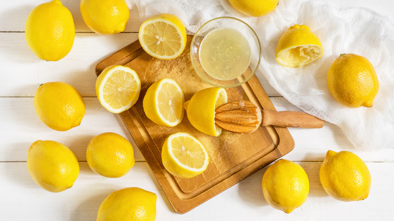 juicing lemons on cutting board