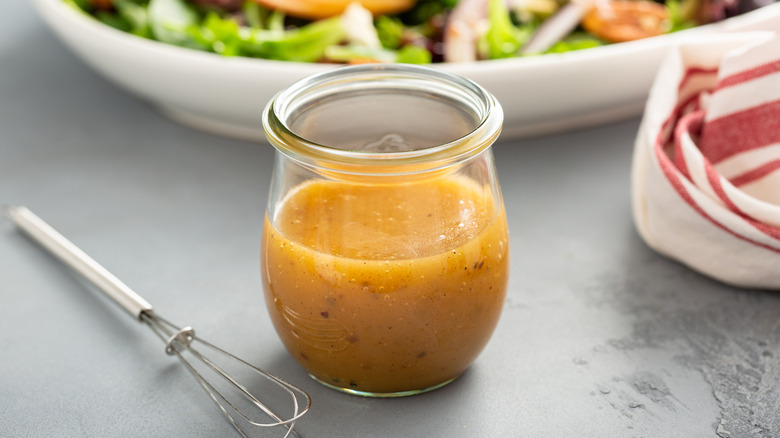 Vinaigrette, whisk, and salad