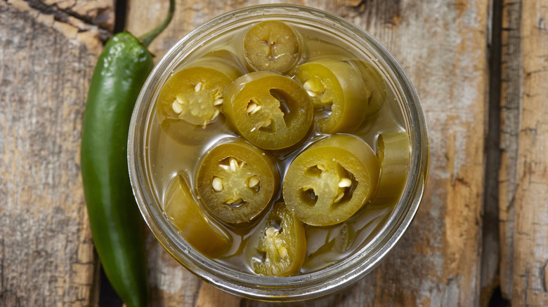 Pickled jalapenos in glass dish