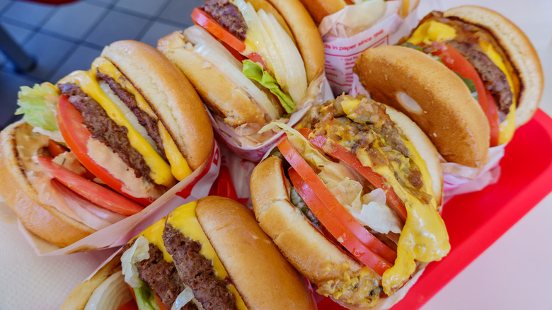An assortment of In-N-Out burgers with different toppings