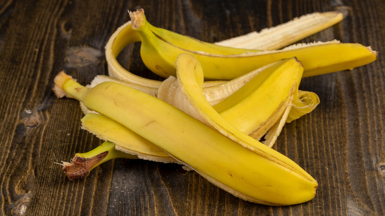 Banana peels on rustic wooden table