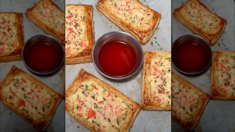 Crab Rangoon puff pastries with sauce