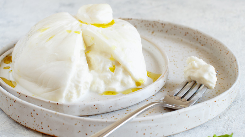Burrata with olive oil and fork