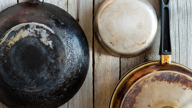 Old pots and pans hanging on wall