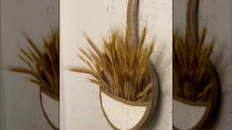 Upcycled pan turned into planter for kitchen wall