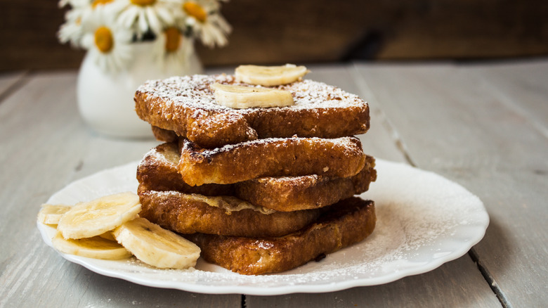 Stack of french toast with banana slices