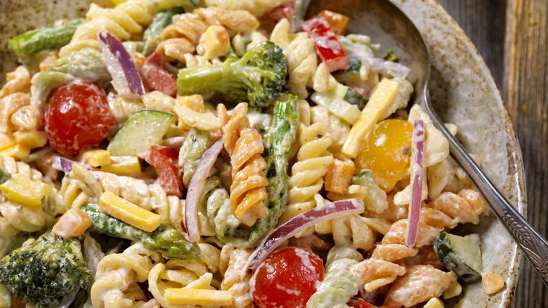 close-up of creamy pasta salad with veggies