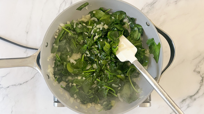 wilting spinach in pan