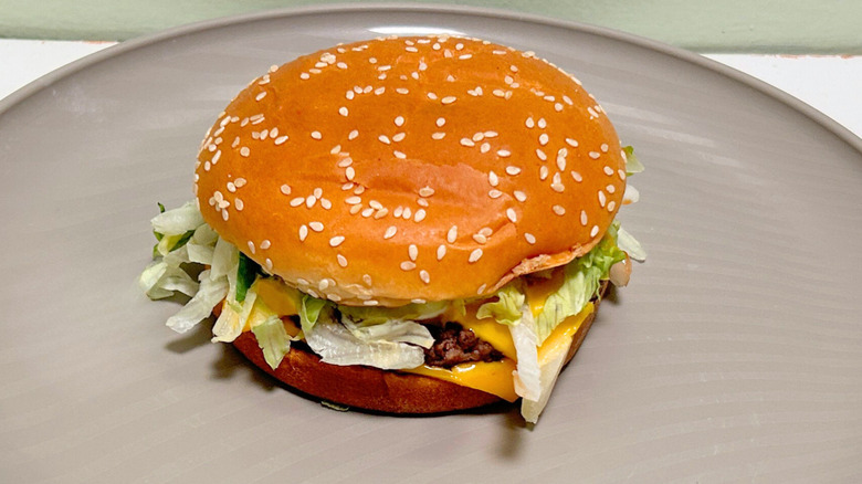 A McDonald's Quarter Pounder with Cheese Deluxe up close
