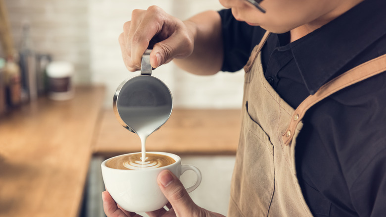 Pouring steamed milk