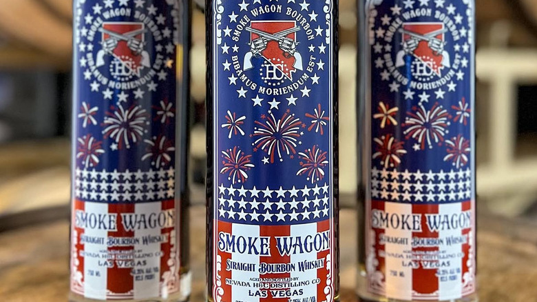 Three bottles of Smoke Wagon Straight Bourbon zoomed in on labels
