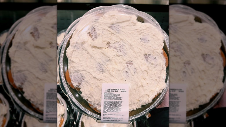 Costco Kirkland Signature Garlic Parmesan Rolls in a display ciontainer