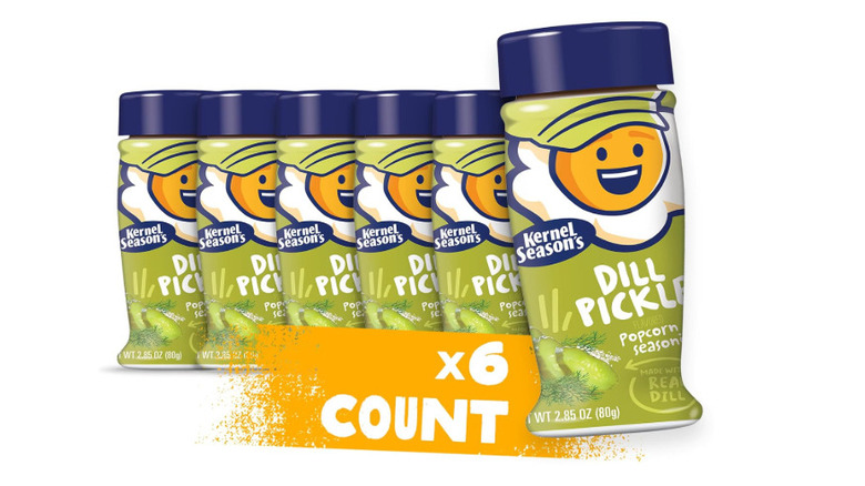 Six Kernel Season's Dill Pickle Popcorn Seasoning lined up in a row