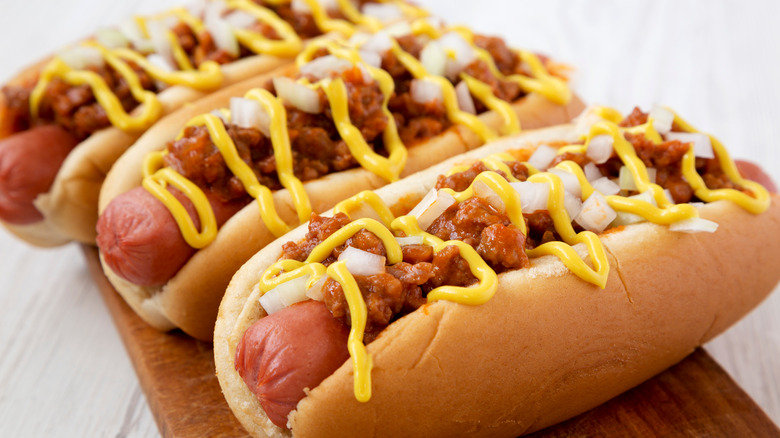 hot dogs topped with chili and cheese