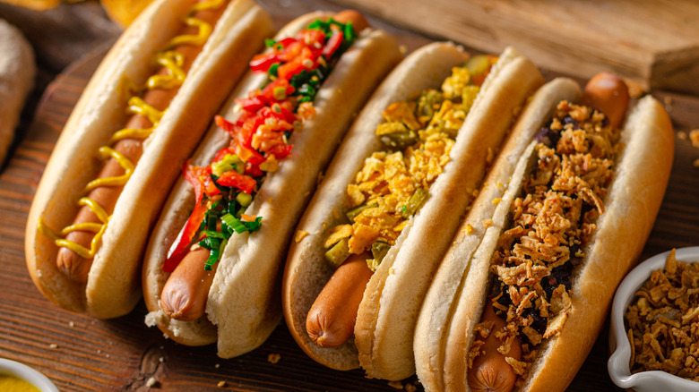 hot dogs with variety of toppings