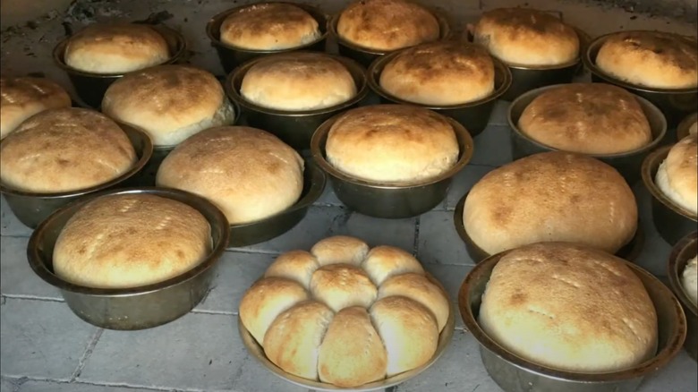 Several loaves of Pueblo bread in round baking tins