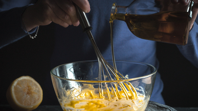 Whisking oil into mayonnaise