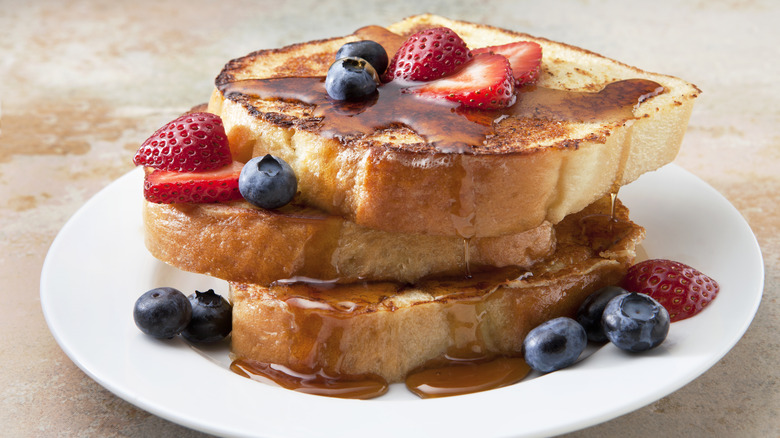 French toast with berries on a plate