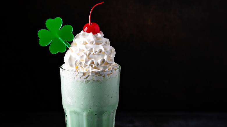 Shamrock shake with cherry and lollipop 