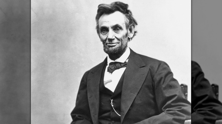 A black and white photo portrait of Abraham Lincoln