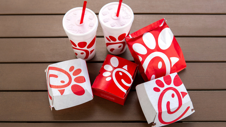 Chick-fil-A sandwich boxes, drinks and fries
