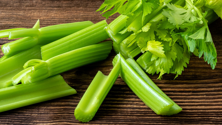 Cut celery stalks on board