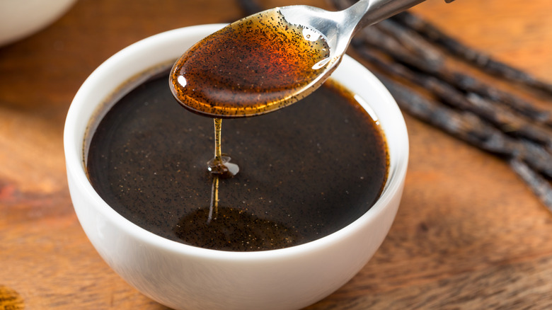 Bowl of vanilla bean paste and spoon