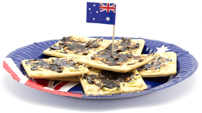 Vegemite spread covering Australian crackers
