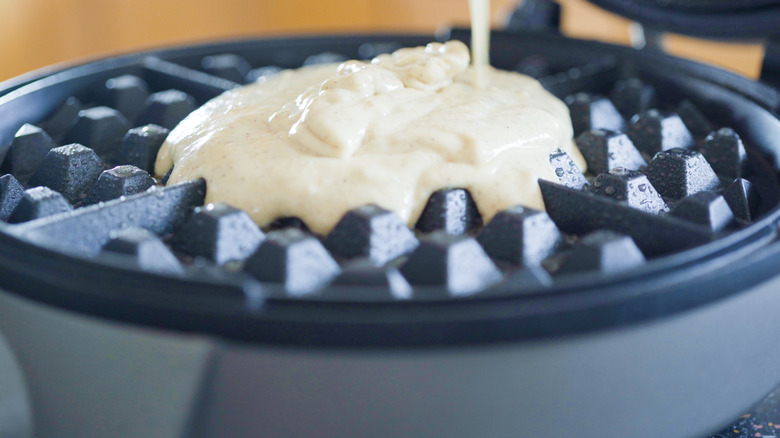 Waffle batter poured waffle iron