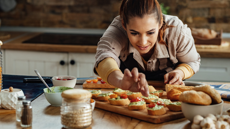 a chef tops crostini