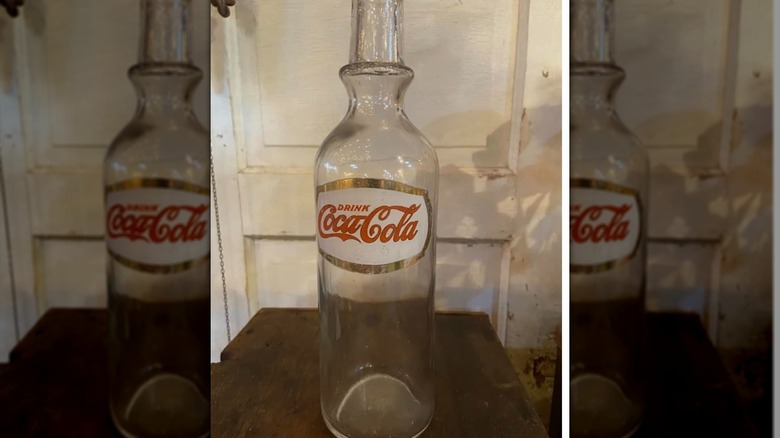 A vintage Coca-Cola soda fountain syrup bottle