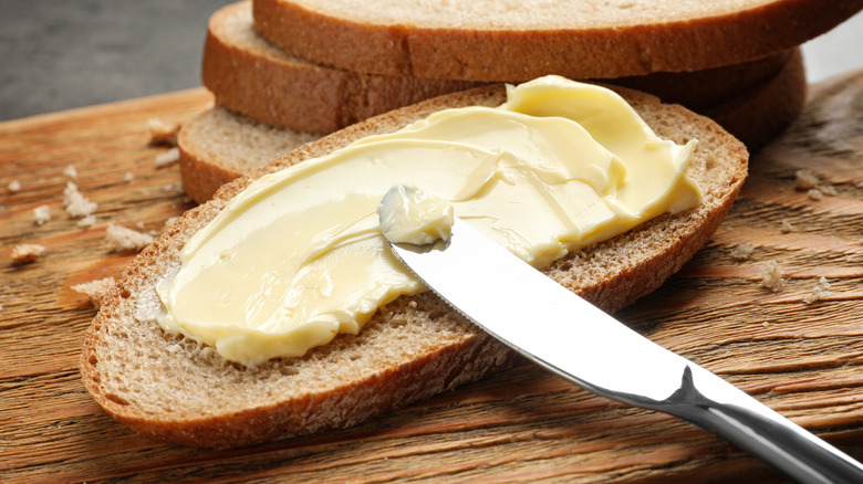spreading butter on bread