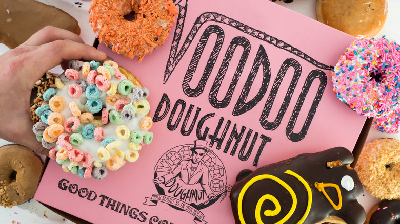 pink box near Voodoo donuts