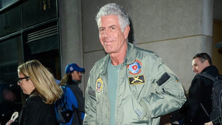 Bourdain walking down the street