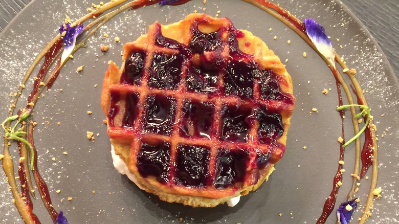 jelly-covered wonut on a plate