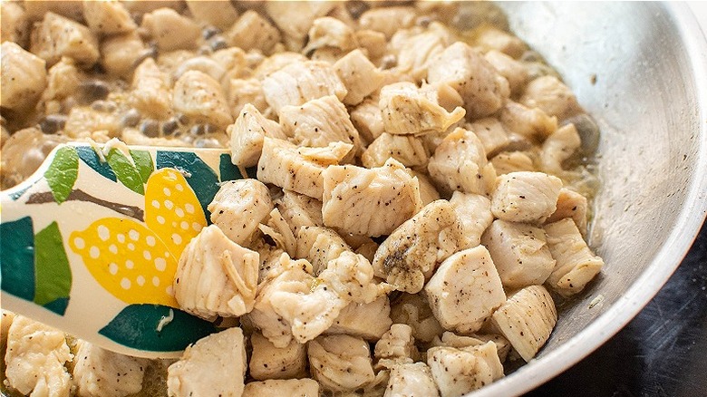 cooking chicken in a skillet