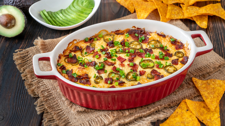 A cheese dip with bacon bits