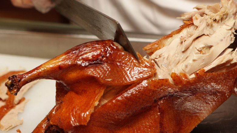 cutting roast duck