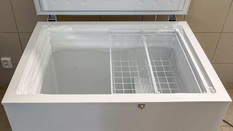 Assorted frozen foods in an open chest freezer