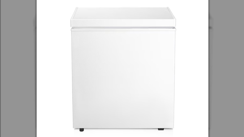 A square white chest freezer on a white background