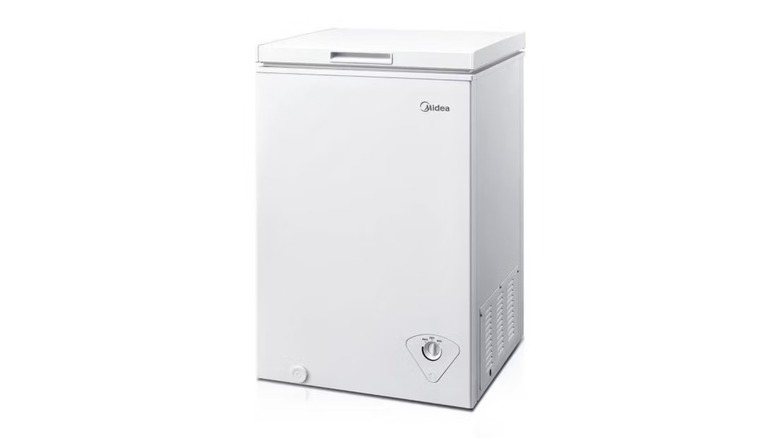 A white rectangular chest freezer on a white background