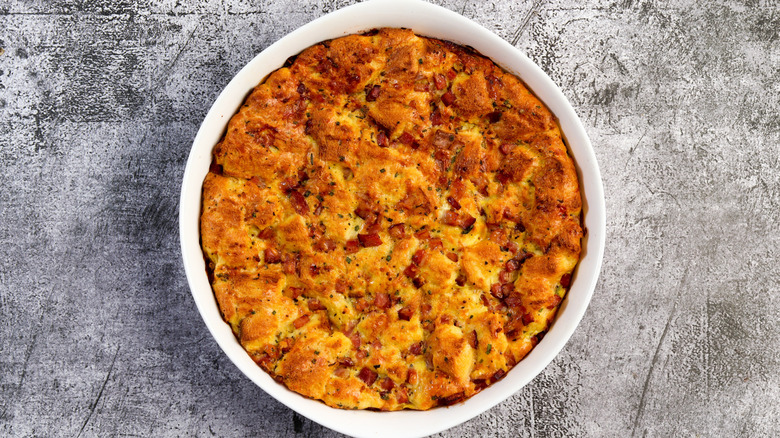 A baking dish full of breakfast strata on a table