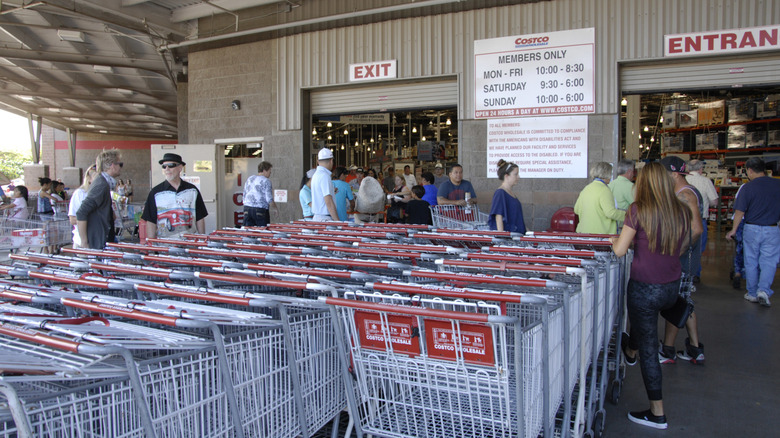 Shoppers queue outside the Kahului Costco