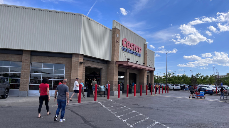 Customers walk into the Salt Lake City Costco