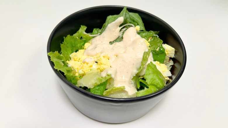 A bowl of Texas Roadhouse Caesar Salad against a white background