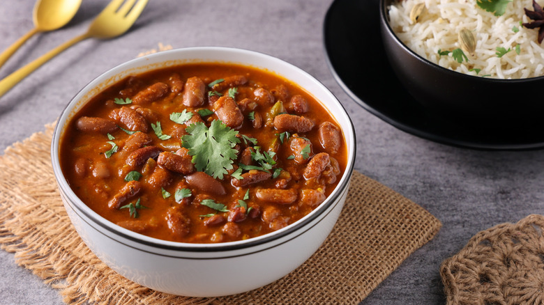 Kidney bean curry with rice both in bowls