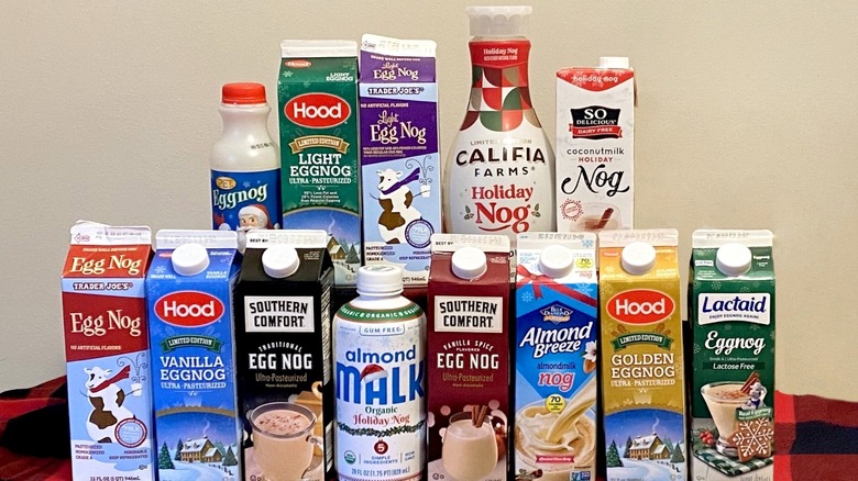 Selection of store-bought eggnog bottles and cartons